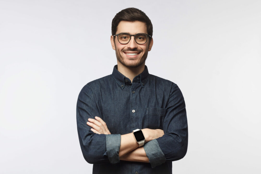 man with crossed arms working as product manager