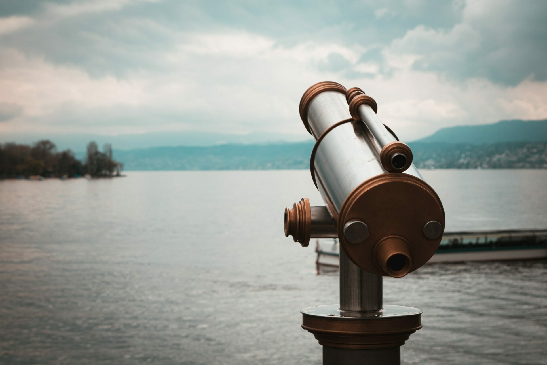 binoculars in front of a lake